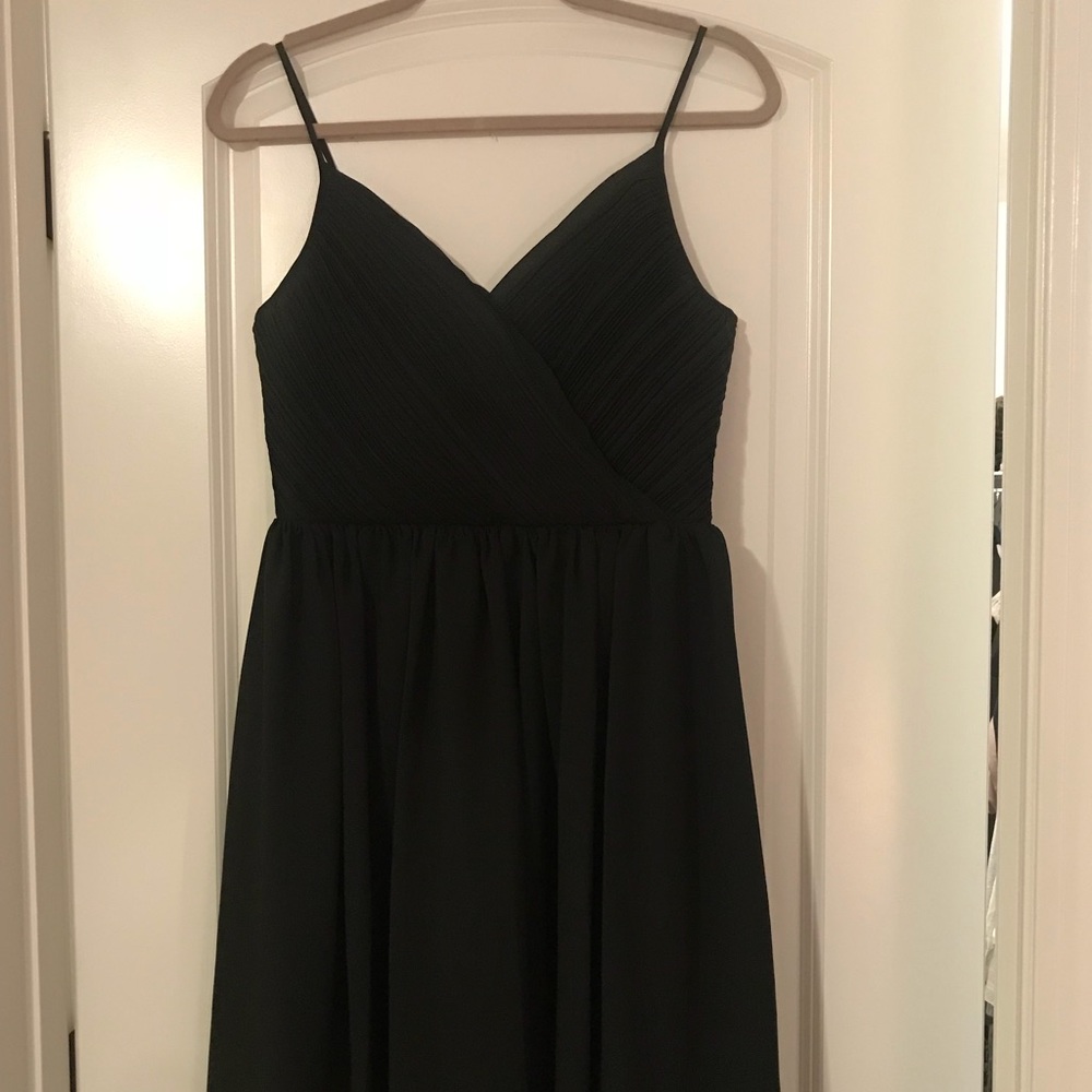 Black, spaghetti strap midi with tags on.